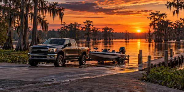 Louisiana landscape and vehicles at sunset